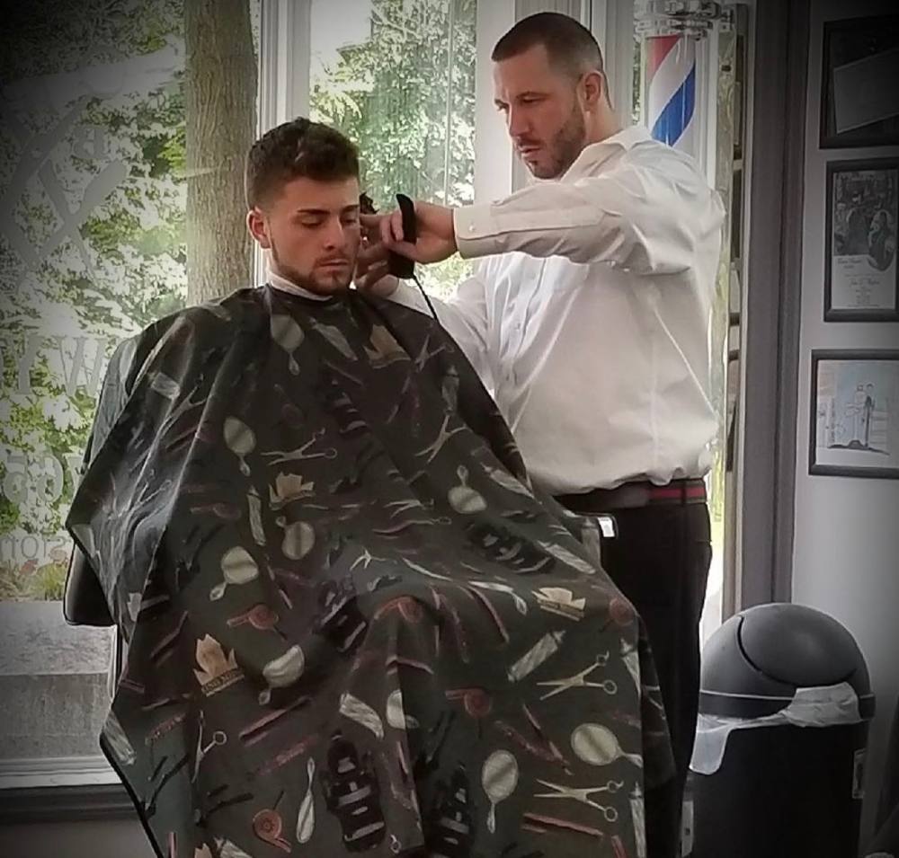 Justin giving a classic men's haircut