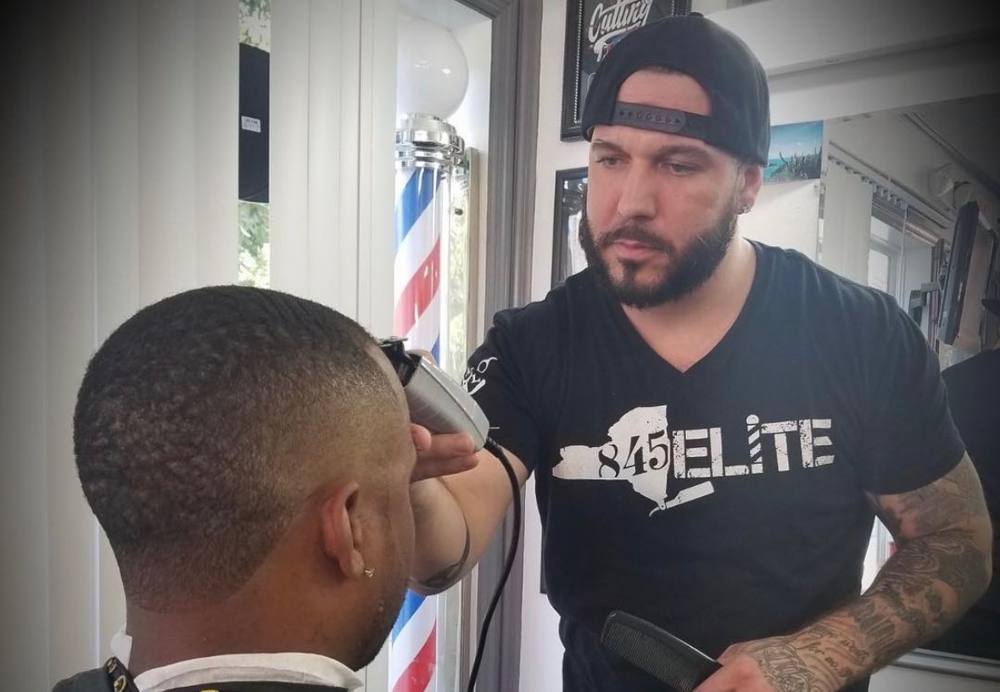 Justin cutting a fade with clippers