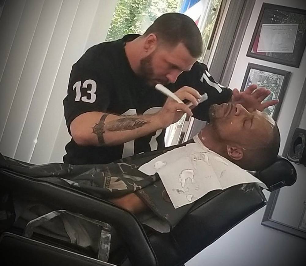 Justin giving a straight-razor hot-towel shave